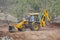 Excavator Loader Backhoe Digger at Road Construction Site