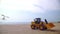 Excavator loader model standing on the sand