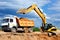 Excavator loading dumper truck