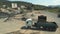 Excavator loading gravel in dump truck.