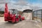 Excavator loading salt for road treatment in winter