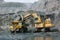 Excavator loads ore