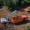 Excavator loads soil into the back of a truck, top view - July 10, 2020, Moscow, Russia