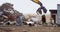 Excavator machine being operated in the junkyard 4k