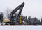 Excavator machine covered with some snow in winter time