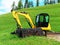 Excavator machine in the field at summer