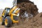 Excavator machine unloading soil