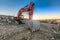 Excavator in a mining factory where stone is extracted