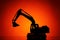 excavator model silhouette, orange background