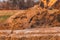 The excavator moves the concrete slabs to set the road in private territory