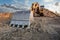 Excavator moving dirt and sand at a construction site in Spain