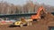 Excavator moving sand into a truck, time lapse