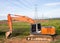 Excavator orange machinery, in the construction site