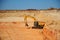 Excavator in a quarry during excavation