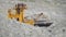 Excavator in a quarry for limestone mining moves ore in railway cars. Mining industry.