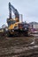 Excavator during the reconstruction of a street roadway in Perm, Russia