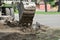 An excavator removes old asphalt for laying a new road