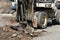 An excavator removes old asphalt for laying a new road