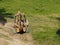 Excavator rides on a rural road