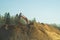 Excavator stands on the sand hill and digs the ground. part of construction earthmoving equipment