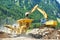 Excavator and stone crusher machine