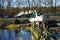 An excavator to clean up the Wuhle river bed at the dam. Berlin, Germany