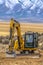 Excavator in Utah Valley with mountain background