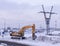 Excavator vehicle on city background at winter. industrial, seasonal.