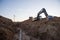 Excavator at work trenching at a construction site. Trench for laying external sewer pipes. Sewage drainage system for a multi-