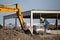 Excavator working at building site