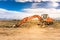 Excavator working on the construction of the extension works of the Madrid - Segovia - Valladolid highway Spain