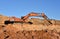 Excavator working on earthmoving at open pit mining. Backhoe digs gravel in quarry. Construction machinery for excavation, loading