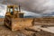 Excavator working on a muddy construction site