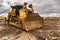 Excavator working on a muddy construction site