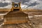 Excavator working on a muddy construction site