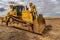 Excavator working on a muddy construction site