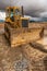 Excavator working on a muddy construction site