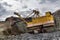 Excavator works or ore at opencast mining