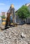 Excavator works at the road construction