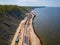 Excavator works on the seashore, strengthening the Baltic Sea coastline