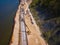 Excavator works on the seashore, strengthening the Baltic Sea coastline