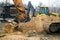 Excavators machine in construction site on sky background