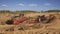 Excavators and trucks working in the quarry