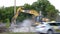 Excavators work on raking concrete blockages at a construction site in the city.