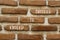 Exceed to succeed symbol. Concept words Exceed to succeed on beautiful brown brick. Beautiful brown brick wall background.