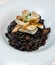 An excellent gourmet dish of seafood paella with squid ink and black rice