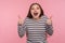 Excellent job, I like it! Portrait of overjoyed excited woman in striped sweatshirt doing thumbs up