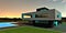 Excellent twilight view of the contemporary country house built according to the individual design. Elegant illumination of the