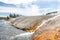 Excelsior Geyser flowing into the Firehole River at Yellowstone National Park