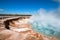 Excelsior Geyser in the Midway Geyser Basin next to the Firehole River in Yellowstone National Park in Wyoming